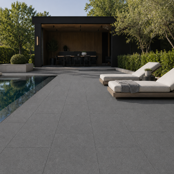 ModaPAVE 32x16 grade-set wet-cast concrete pavers in Graphite installed in a modern outdoor lifestyle setting — ModaConcrete