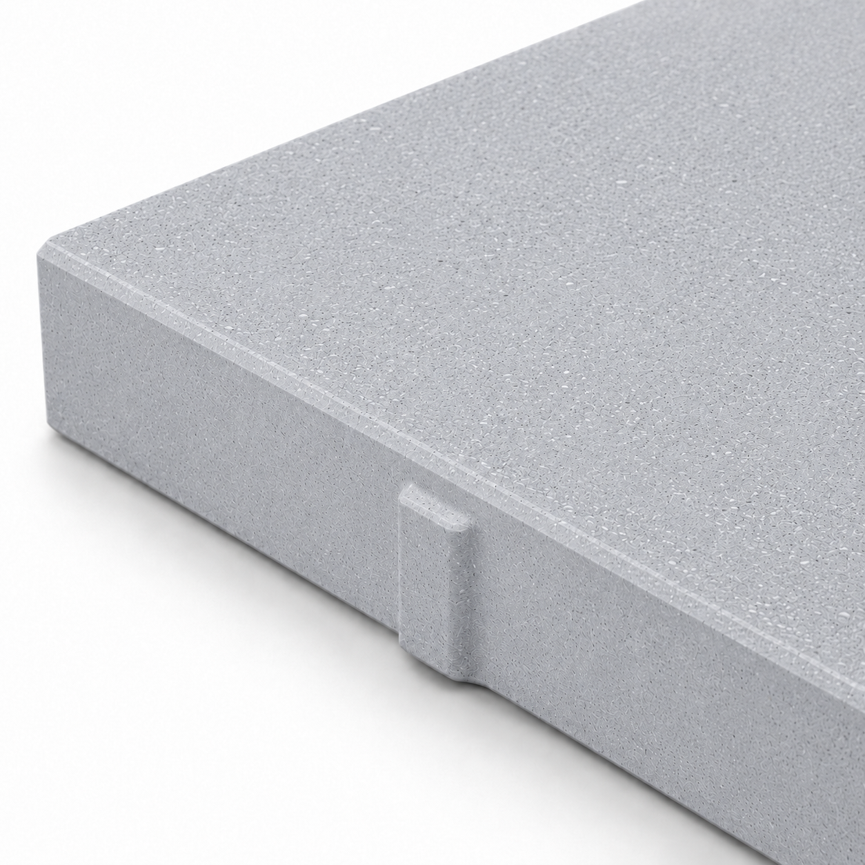 Close-up of a ModaPAVE 32x16 grade-set wet-cast concrete paver in Platinum showing the pale micro-terrazzo surface and eased edge — ModaConcrete
