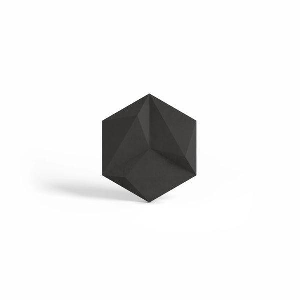 ModaWALL ORION 3D concrete wall tile in Graphite, studio render of the faceted hexagon