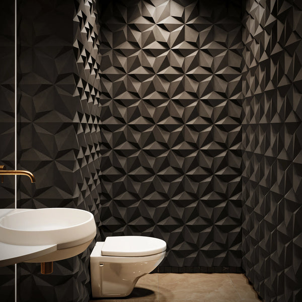 ModaWALL ORION 3D concrete wall tile in Graphite lining a powder room with wall-hung toilet