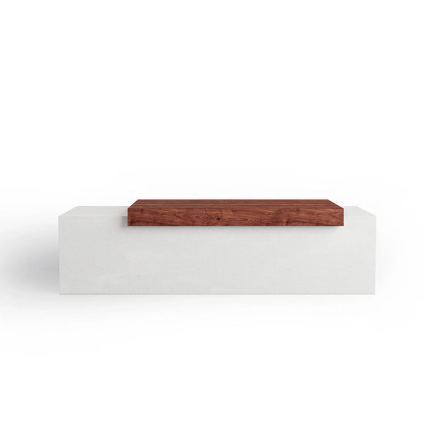 Tapered ModaCAST GFRC concrete bench in white with wood plank seat, front studio view