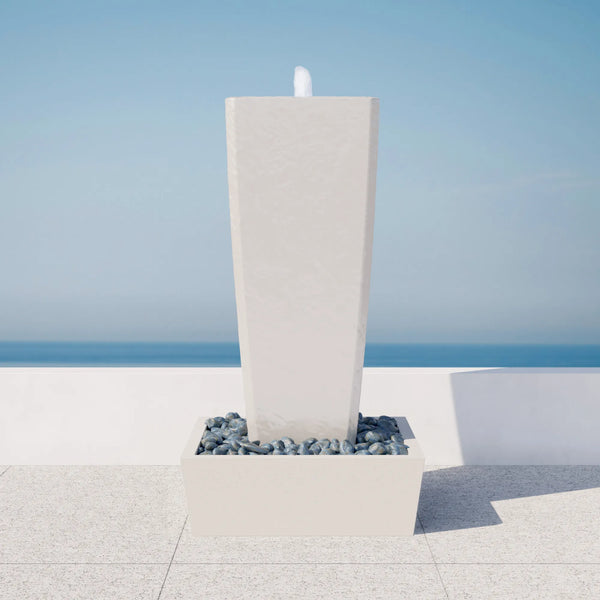 Vasa 52 in. ModaCAST StoneCast fountain set, white finish, eye-level view on a seaside terrace